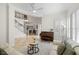 Bright living room with piano and staircase. An open and airy design for comfortable living and entertaining at 2207 Climbing Ivy Dr, Tampa, FL 33618