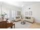 Cozy living room featuring plush seating, natural light, and neutral tones for a relaxing atmosphere at 2207 Climbing Ivy Dr, Tampa, FL 33618