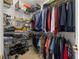 Spacious walk-in closet with extensive shelving and storage options at 2207 Climbing Ivy Dr, Tampa, FL 33618