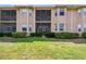 Well-maintained backyard with lush lawn and low shrubbery, ideal for outdoor activities and curb appeal at 1003 Fairwaycove Ln # 103, Bradenton, FL 34212