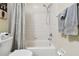Clean white bathroom featuring a shower-tub combo and neutral tile, ideal for a fresh and functional space at 1003 Fairwaycove Ln # 103, Bradenton, FL 34212