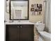 Half bath features a sleek vanity, contemporary sink, and tasteful decor; ideal for guests at 1003 Fairwaycove Ln # 103, Bradenton, FL 34212