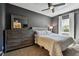 Comfortable bedroom features a large bed, dresser, and mirror; a peaceful retreat at 1003 Fairwaycove Ln # 103, Bradenton, FL 34212