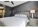Well-appointed bedroom showcases a bed with grey upholstered headboard and side tables, relaxing and stylish at 1003 Fairwaycove Ln # 103, Bradenton, FL 34212
