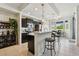 Bright kitchen with dark cabinetry, barstool seating, and stainless appliances at 1003 Fairwaycove Ln # 103, Bradenton, FL 34212