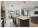 Well-lit kitchen with views and stainless appliances at 1003 Fairwaycove Ln # 103, Bradenton, FL 34212