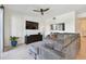 Inviting living room with a large sectional sofa and entertainment center, perfect for relaxation at 1003 Fairwaycove Ln # 103, Bradenton, FL 34212