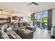Spacious living room open to kitchen, with sliding doors to patio at 1003 Fairwaycove Ln # 103, Bradenton, FL 34212