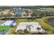 Community recreation area featuring sand volleyball courts, shuffleboard, and lush landscaping at 1003 Fairwaycove Ln # 103, Bradenton, FL 34212