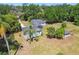 Quaint single-story home surrounded by lush greenery and mature trees at 101 N Taylor Rd, Seffner, FL 33584