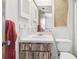 Modest bathroom featuring a white sink and a wooden cabinet below the mirror at 101 N Taylor Rd, Seffner, FL 33584