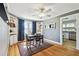Charming dining room features hardwood floors, ample natural light, and built-in shelving for storage and display at 101 N Taylor Rd, Seffner, FL 33584