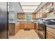 Well-lit kitchen with modern appliances, wooden cabinets, and ample counter space at 101 N Taylor Rd, Seffner, FL 33584