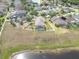 Aerial view of a home showcasing its backyard pool and the lake nearby at 10911 Rockledge View Dr, Riverview, FL 33579