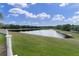 Expansive backyard lawn overlooking a scenic lake at 10911 Rockledge View Dr, Riverview, FL 33579