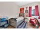 Charming bedroom with a window and stylish decor, creating a personalized and inviting space at 10911 Rockledge View Dr, Riverview, FL 33579