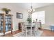 Charming dining room with hardwood floors and vintage furnishings at 10911 Rockledge View Dr, Riverview, FL 33579