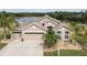 Charming home featuring a three-car garage, well-maintained landscaping, and proximity to a lake at 10911 Rockledge View Dr, Riverview, FL 33579