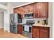 Well-equipped kitchen boasts dark wood cabinets, stainless steel appliances at 10911 Rockledge View Dr, Riverview, FL 33579