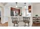 Open concept kitchen featuring a breakfast bar with seating and views into the dining area at 10911 Rockledge View Dr, Riverview, FL 33579