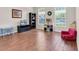 Bright living room with wood-look floors, large windows, and a charming area at 10911 Rockledge View Dr, Riverview, FL 33579