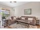 Spacious living room with comfortable sofas, wood floors, and sliding glass doors leading to the outside at 10911 Rockledge View Dr, Riverview, FL 33579