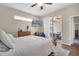 Bedroom with a patio walkout, a TV, soft decor, and natural light creates an inviting atmosphere at 10911 Rockledge View Dr, Riverview, FL 33579