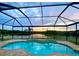 Relaxing screened-in pool area with beautiful sunset view and lake access at 10911 Rockledge View Dr, Riverview, FL 33579