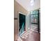 Apartment entrance featuring a green door with secure gate and visible unit number 108 at 1216 S Missouri Ave # 108, Clearwater, FL 33756