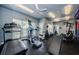 A view of the gym with modern equipment, ceiling fans and large windows at 1216 S Missouri Ave # 108, Clearwater, FL 33756