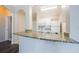 Stylish kitchen with granite countertops, stainless steel sink, and white appliances at 1216 S Missouri Ave # 108, Clearwater, FL 33756