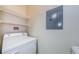 Convenient laundry room featuring a stacked washer and dryer unit at 1216 S Missouri Ave # 108, Clearwater, FL 33756