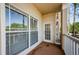 Cozy outdoor patio with door, windows and railing at 1216 S Missouri Ave # 108, Clearwater, FL 33756