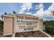 Attractive community sign for The Residence at Renaissance Square and The Avalon with manicured landscaping at 1216 S Missouri Ave # 108, Clearwater, FL 33756