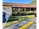 Exterior of a condominium building with a red roof, surrounded by well-maintained landscaping and shrubbery at 12315 Touchton Dr # 90, Tampa, FL 33617
