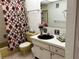 Bathroom featuring a bathtub, yellow toilet, black sink, and decorative shower curtain at 1301 S Hercules Ave # 19, Clearwater, FL 33764