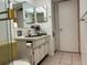 Bathroom with a vanity, sink, and ample lighting, plus a view of the toilet and shower at 1301 S Hercules Ave # 19, Clearwater, FL 33764