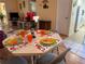 Dining room showcasing a set table with seating for four and an open-concept view into the kitchen at 1301 S Hercules Ave # 19, Clearwater, FL 33764