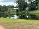 Scenic water view showcasing the community with lush landscaping and serene reflection at 1301 S Hercules Ave # 19, Clearwater, FL 33764