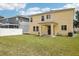 Backyard featuring a covered patio and privacy fence in the distance at 13506 Copper Belly Ct, Riverview, FL 33569