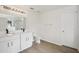 Spacious bathroom with a dual sink vanity and modern light fixture at 13506 Copper Belly Ct, Riverview, FL 33569