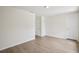 Bright bedroom with light wood-look flooring and neutral paint at 13506 Copper Belly Ct, Riverview, FL 33569