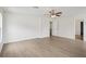 Bright bedroom boasts laminate floors, ceiling fan and spacious closet at 13506 Copper Belly Ct, Riverview, FL 33569