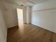 Walk-in closet with wood-look floors and built-in shelving for ample storage at 13506 Copper Belly Ct, Riverview, FL 33569