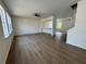 Open concept living room offering wood-look floors, natural light, and neutral paint at 13506 Copper Belly Ct, Riverview, FL 33569