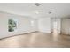 Spacious upstairs living room has laminate floors and lots of natural light at 13506 Copper Belly Ct, Riverview, FL 33569