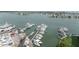 Aerial view of a marina with many yachts and sailboats docked in the bay at 14506 Alejo Ct, Seminole, FL 33776