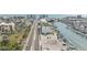 Aerial shot showcasing street, waterfront access, building with green roof and parking at 14506 Alejo Ct, Seminole, FL 33776