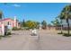 Charming community entrance with lush landscaping and inviting atmosphere at 14506 Alejo Ct, Seminole, FL 33776