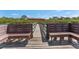 Benches line the community dock, offering panoramic waterfront views at 14506 Alejo Ct, Seminole, FL 33776